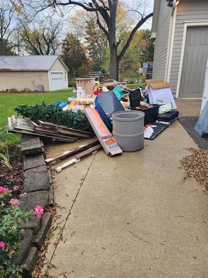 Dumpster being loaded with debris for Commercial Dumpster Rental in Oak View